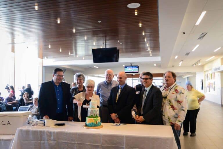 PSC to LAX Airport route launch cake cutting